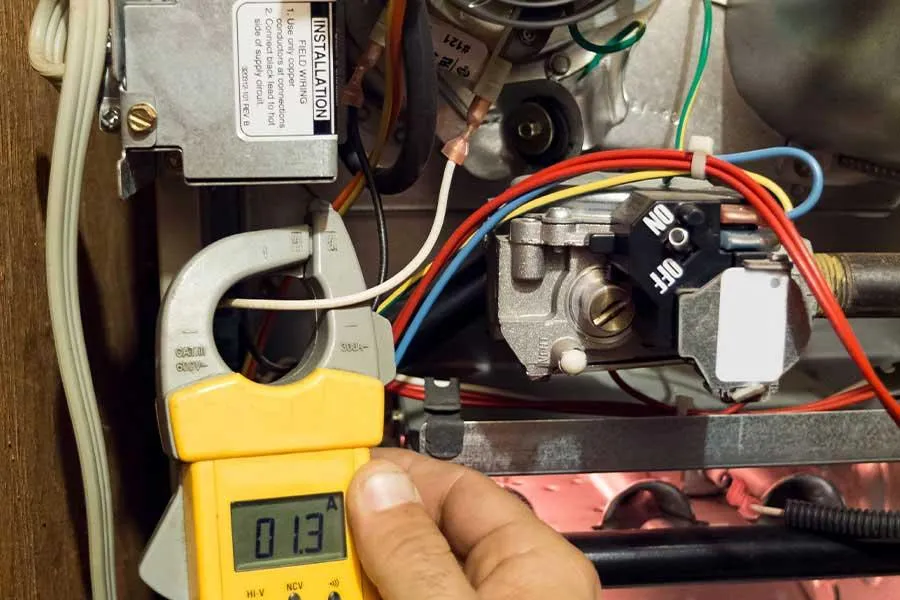 Technician performing furnace repair